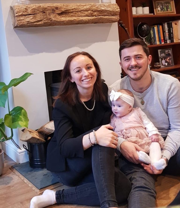 Cameron Booth and Sophie Booth with their daughter Sola.
