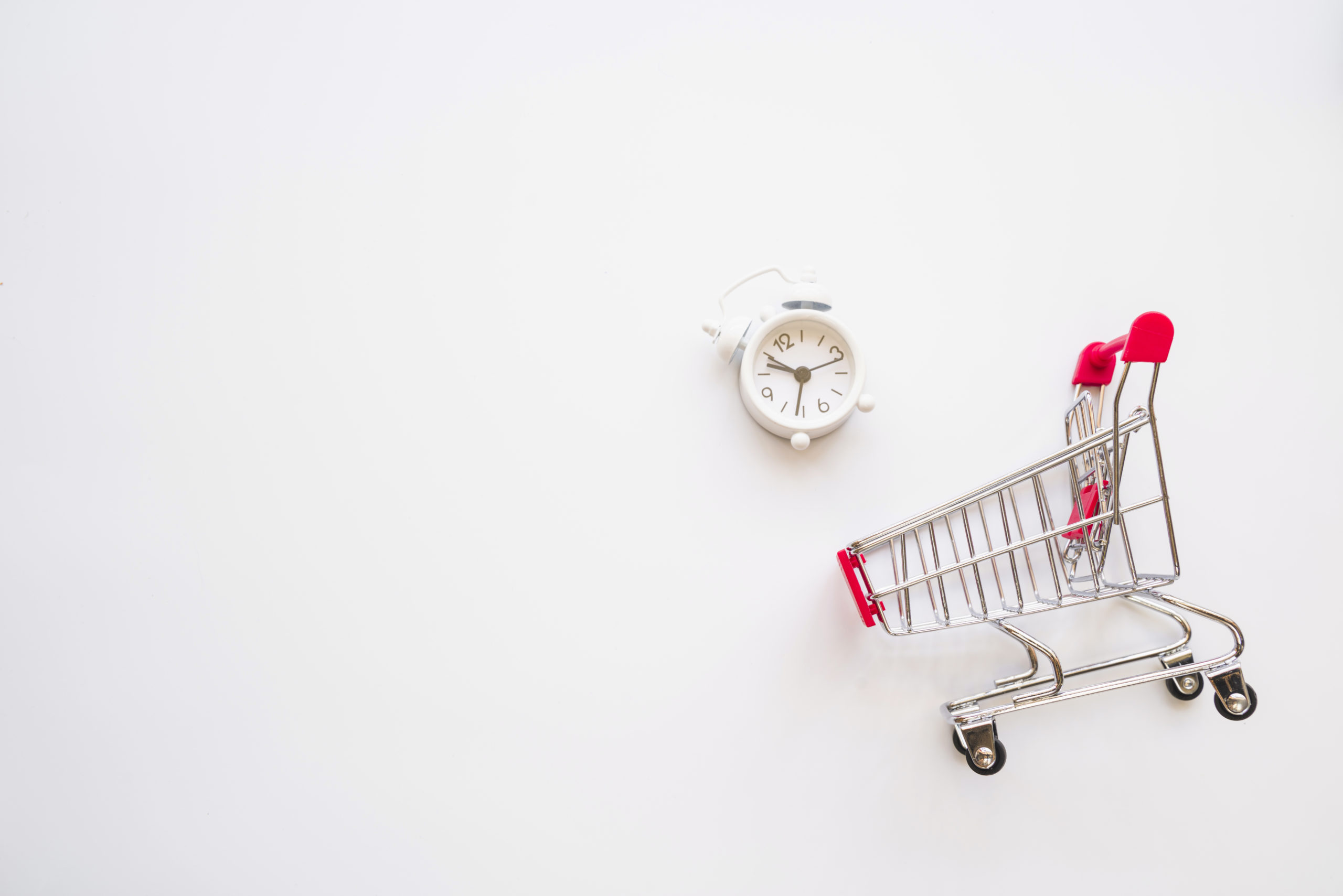 Picture of a shopping trolley and a clock